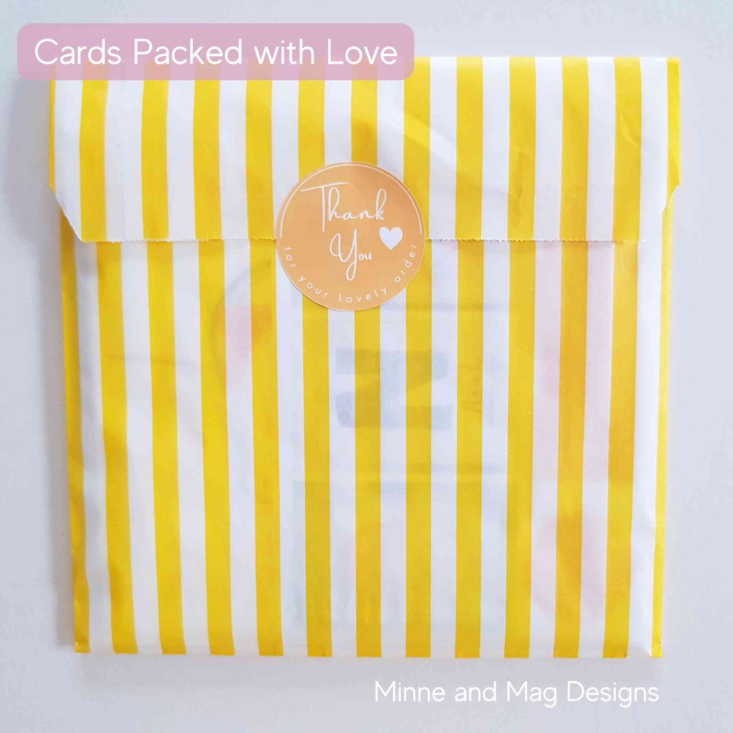 Greeting card wrapped in yellow and white striped back with Thank You sticker.